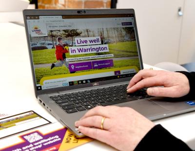 A laptop showing the Living Well website
