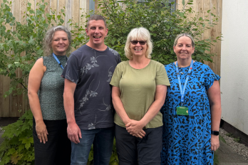 Family with staff outside of the delamere centre. 