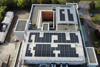 Solar photovoltaic (PV) panels on top of the Captain Sir Tom Moore Building at Halton Hospital.